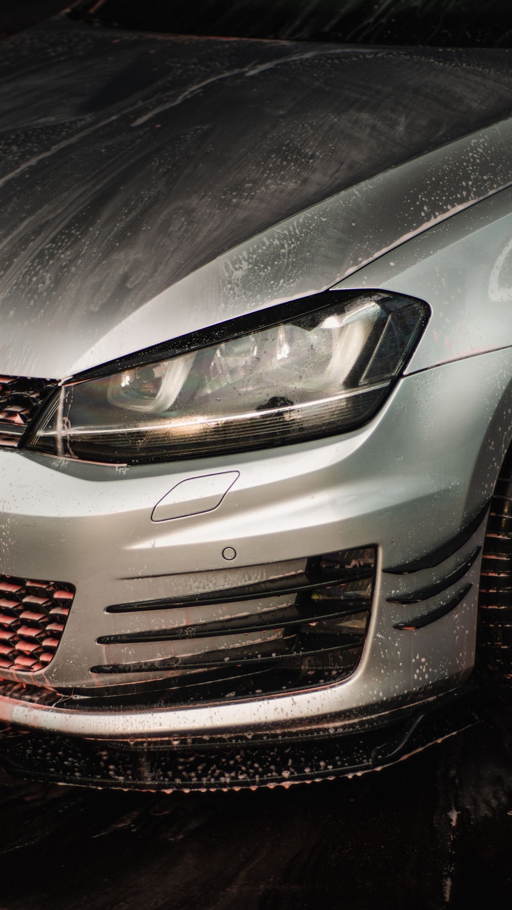 Close-up of a freshly washed car front