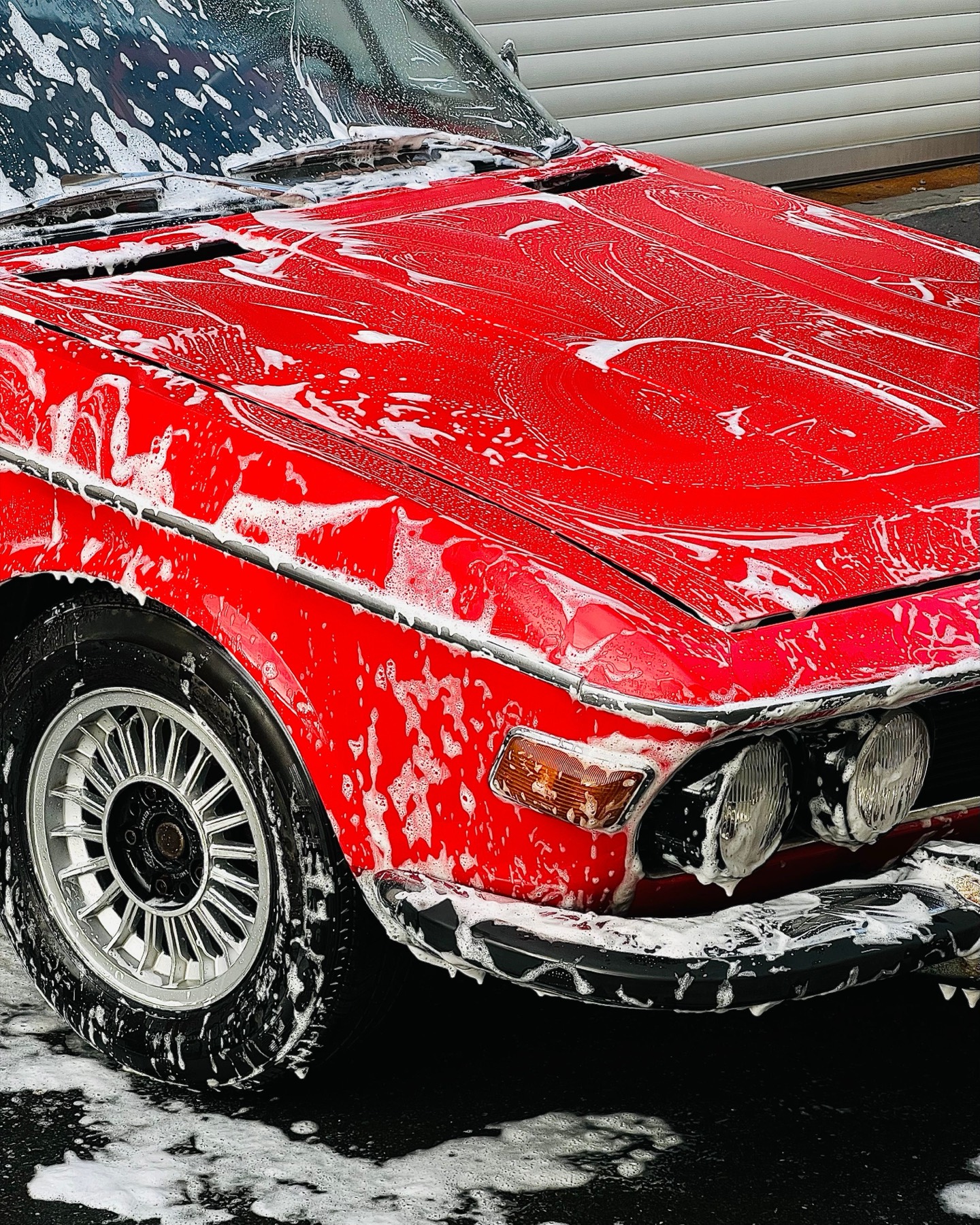 Car covered in wash foam